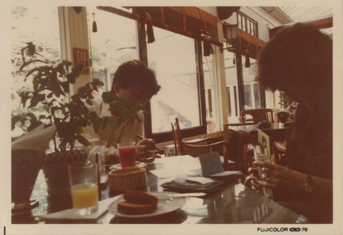 Arakawa and Madeline writing at a breakfast table in Japan (1979)